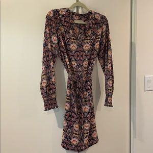 Knee length flowy dress with smocked wrists